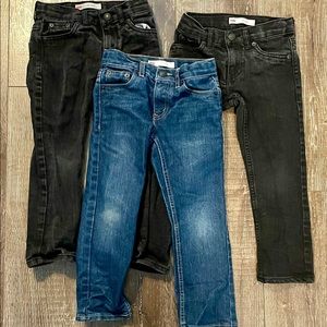 Three pairs of Levi’s 5 REG Slim jeans